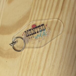 Wanted and wild clear key chain